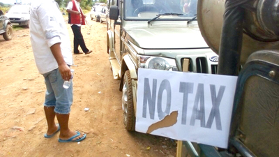 A placard, expressing opposition to “tax” imposed by underground groups in the state, seen here during a rally undertaken by community council leaderships in Dimapur, on June 22. The organizers, Joint Village Council, comprise councils of Darogajan, Kushiabill, Bamunpukhuri-1 and Bamunpukhuri-2, and Zani village.