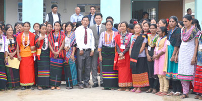 Kesonyu Yhome, in grey suit, seen here with members of local community self-help groups in Dimapur after a program on November 18.