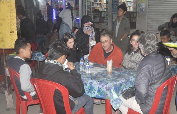 Tourists having a taste of Naga food at the Kohima Night Carnival.