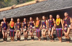 Naga tribesman perform a folk dance in front of their Morung on the second day of the state annual Hornbill Festival at Naga Heritage village Kisama, some 15 kms away from Kohima, Nagaland on Friday, December 02, 2016. Photo by Caisii Mao