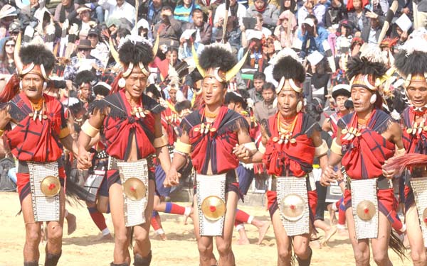 Yimchungru Naga tribesmen dance during the opening day of Nagaland's annual Hornbill Festival at the heritage village, Kisama. (Photo by Caisii Mao)