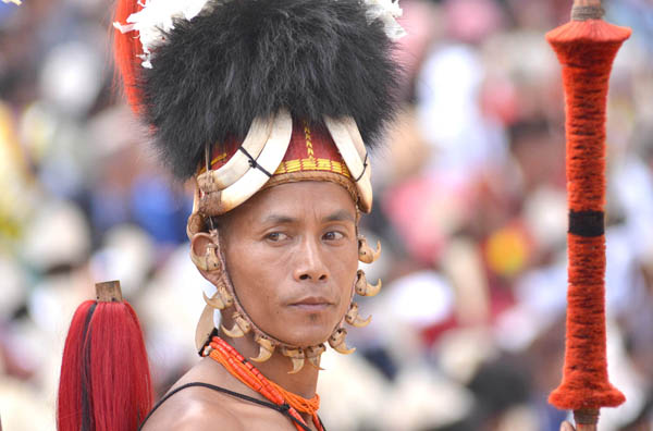 A Naga tribesman waits for his turn at performance. (Photo by Caisii Mao)