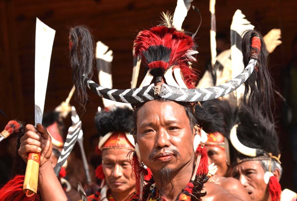 A Konyak Naga man shows a Naga machete at Kisama. (Photo by Caisii Mao)