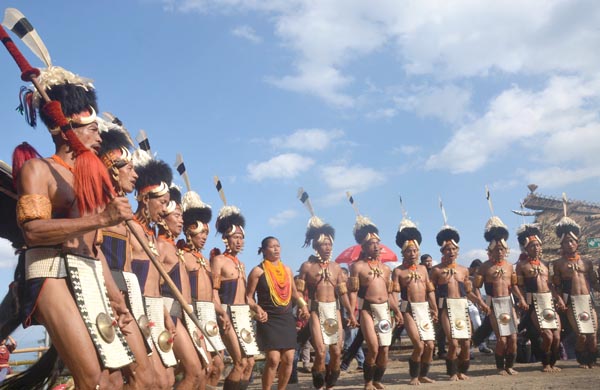Khiamniungan Naga tribesmen dancing during the opening day of Nagaland's annual Hornbill Festival at the heritage village, Kisama. (Photo by Caisii Mao)