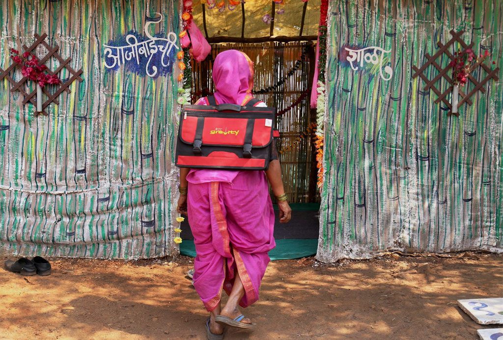 An elderly village woman above 60 years age going for class at a special school at Fangane in Thane