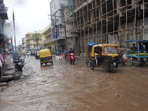 Vehicles struggle through a muddy Kalibari Road Dimapur, just a few kilometres away from the Dimapur Municipal Office.