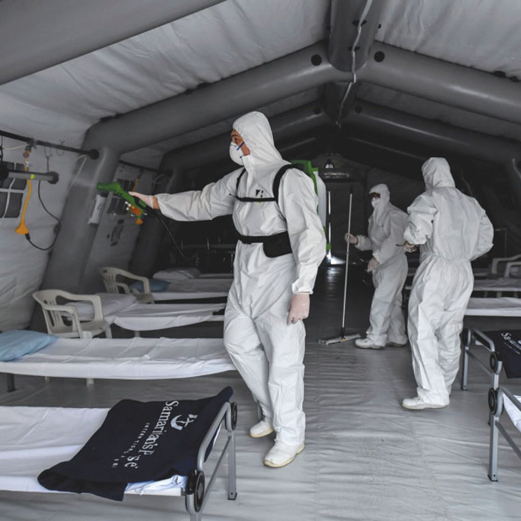 Cremona: Staffers sanitize the Samaritan's Purse field hospital that is being set up in Cremona, northern Italy, Friday, March 20, 2020