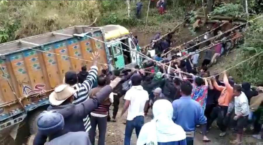A screenshot of men pulling the truck out from a gorge at Kutsapo village on January 8.