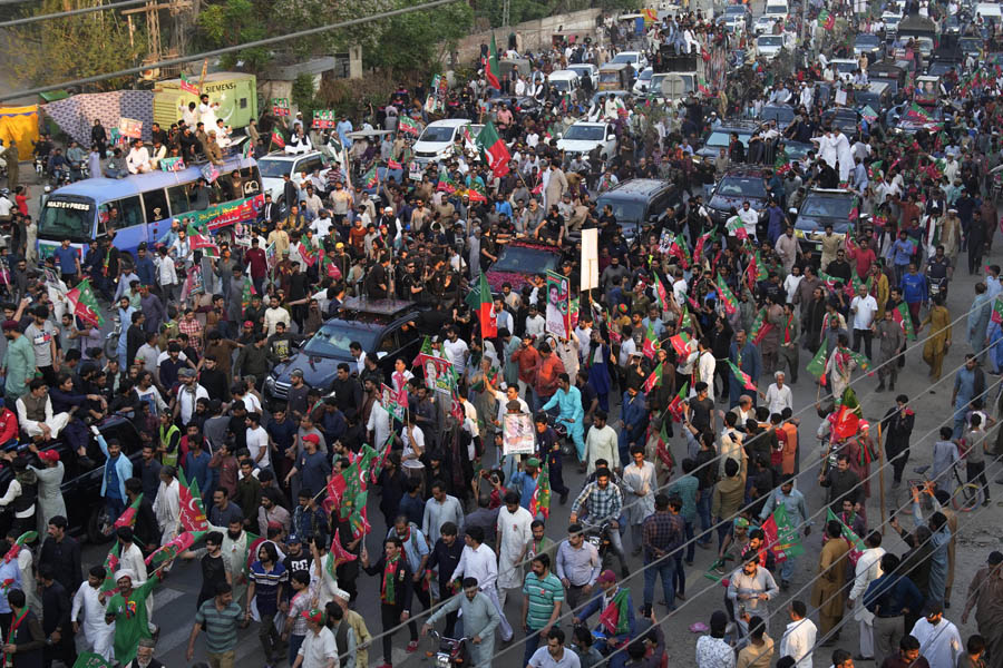 Imran Khan leads thousands at election rally in Lahore as Islamabad police arrive to arrest him
