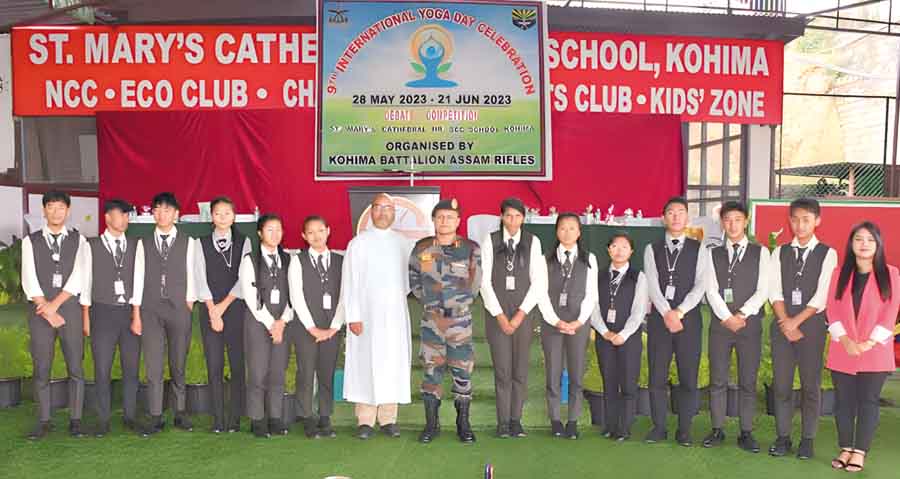 KOHIMA — Col. SBB Sharma, commandant of 1st Assam Rifles, stated that both yoga and physical exercises are vital to keep one healthy. He stated this while speaking at the debate competition held at St. Mary’s Cathedral Higher Secondary School in Kohima on Friday organised by the Assam Rifles on the theme “Yoga vs physical exercises.” “Both yoga and physical exercises are vital for holistic well-being,” emphasised Sharma, who has recently taken over as the commandant of 1st Assam Rifles. He stated that such health interventions are becoming important at the present times due to the social-economic environment, where people are unable to find proper places to engage in health–related activities due to the lack of playgrounds and basic sports amenities. He added that it is also becoming essential more so with the digital intervention into the lives of people adding yoga could be practiced in one’s room over a mat. Sharma said yoga balances mind, body and spirit while physical exercises too focus on the body, adding that both promote healthy living. Appreciating the participants, who brought out all the aspects of yoga and physical exercises during the debate, he apprised that the aim of the competition was not to create confusion between the two physical workouts. He stated that engaging in both the activities would lead to good health mentally, physically and spiritually. He also informed that a series of events would be organised in preparation for the celebration of Yoga International Day. The debate featured two groups – Team Yoga and Team Physical Exercises comprising 12 students from various classes, who enthusiastically participated in the debate competition. Team Yoga highlighted that yoga is a connection of body, mind and spirit which focuses on the whole unification of physical, mental and emotional development. According to them, diet can be a hindrance in physical exercise whereas in yoga that is not a concern adding that to practice yoga, there is no age limit. The students stated that over exercising could trigger health issues, whereas yoga gives internal fitness which is more beneficial than physical exercises. They observed that yoga helps to accept oneself and can help in getting proper sleep and increase concentration. On the other hand, Team Physical Exercises maintained that physical exercise is necessary for an individual's healthy life in today's modern world and that at certain point yoga is part of physical exercise. The participants were of the opinion that physical exercise can build up confidence and also keep the body, mental and emotional balanced. The debaters have highlighted how physical exercise inculcates discipline in a person. After a stiff competition, Team Yoga was declared the winners. The judges of the debate competition included Maj. Aneesh Chandran C, Kekhriesenuo Monica Solo, Sachindev Thongam and Mhozienuo Kenguruse. SBB Sharma and Rev. Fr. Vemedo Kezo, principal of the school, felicitated the winners and participants with prizes and citations.